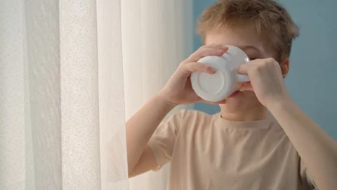 Boy with white mug Video stock 329923527
