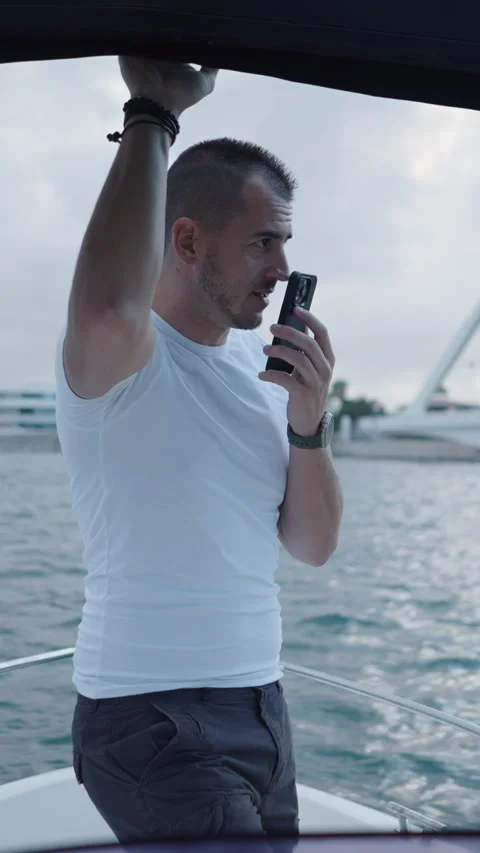 Boy with white tshirt sends an audio Stock Footage 264923702