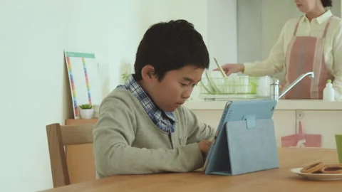 Boy who operates tablet pc Stock Footage 159811297