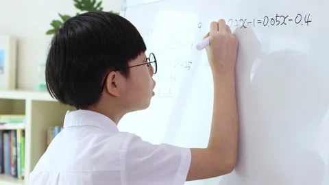 A boy who studies hard and solves math problems Stock Footage 170114917