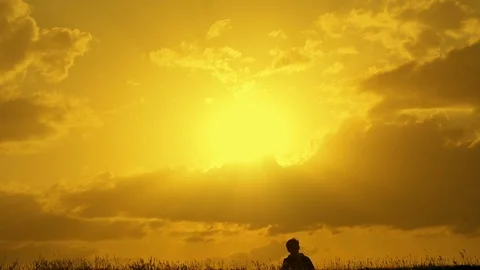 Boy winner jump top at sunset Stock Footage 75310170