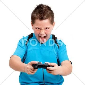 Boy with winning attitude playing with console Stock Photos