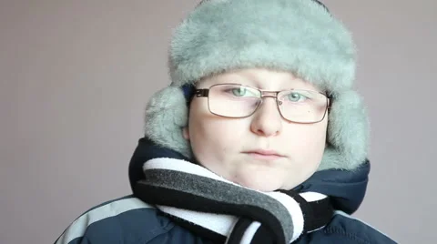 Boy in winter clothes looking at the camera Stock Footage 58867065