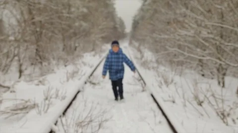 Boy in winter in the forest Stock Footage 84760443