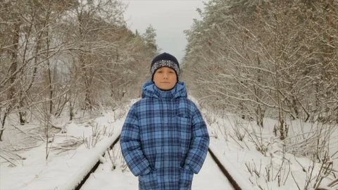 Boy in winter in the forest Stock Footage 85064845