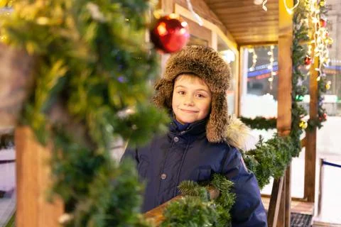 Boy in a winter hat at the New Year's fair Stock Photos
