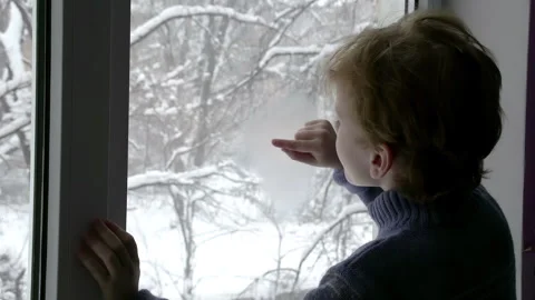 Boy in the Winter Window 4K TZ Stock Footage 313387827