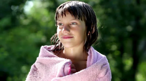 Boy wiping himself with a towel Stock Footage 24920171