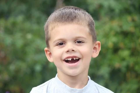A boy without a tooth. Selective focus. Stock Photos
