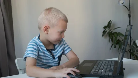 Boy working on a computer, programming, learning or playing Stock Footage 120717278