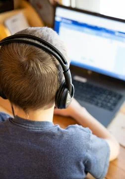 Boy working on computer for school Stock Photos