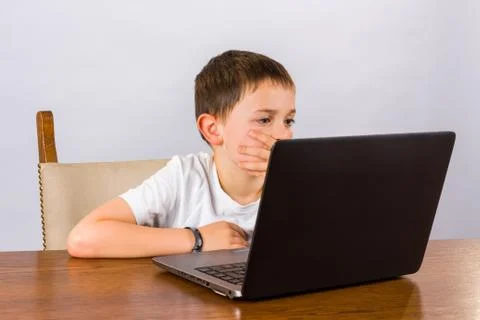 Boy working on laptop Stock Photos
