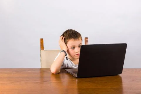 Boy working on laptop Stock Photos