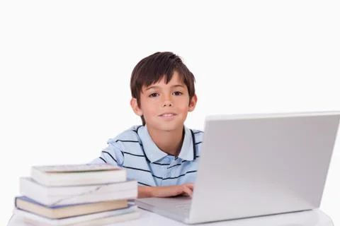 Boy working with a notebook Stock Photos