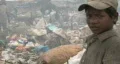 Boy works at dump in Phnom Penh HD Footage