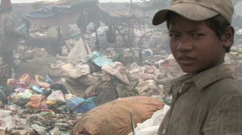 Boy works at dump in Phnom Penh Stock Footage