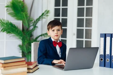 A boy works at a laptop in a computer lab education learning programming 스톡 사진