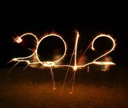 The boy write 2012 new year (fires) Stock Photos