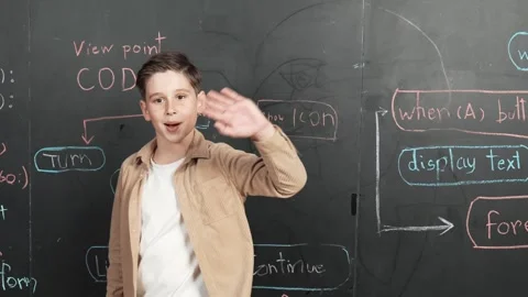 Boy write engineering prompt while turn around and waving to camera. Erudition. Stock Footage 273464526