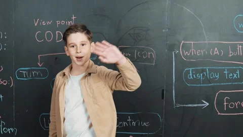 Boy write engineering prompt while turn around and waving to camera. Erudition. Stock Footage 276231742
