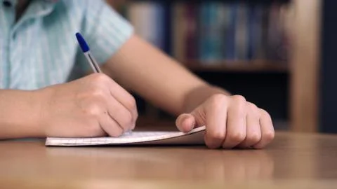 Boy writes and thinks Stock Photos
