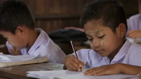 Boy writes at His Desk Stock Footage 37350217
