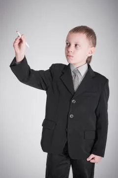 Boy writes Stock Photos