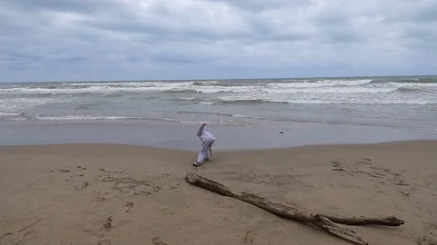 The boy writes in the sand Stock Footage 108467854