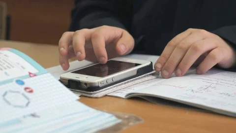 Boy writes text using mobile phone. Close-up Stock Footage 77697167