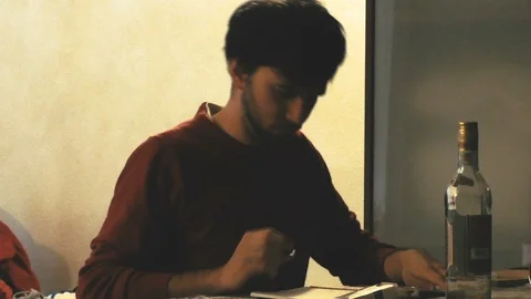 Boy Writing and Smoking inside Room Video stock 87204723