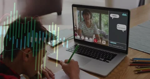 Boy writing green pencil at table during online lesson, chat messages causing Stock Footage 330033011
