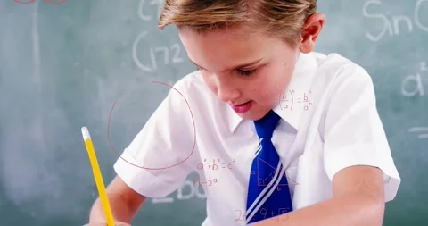 Boy writing math problem on school desk initiating shape animations visualizing Stock Footage 328642739