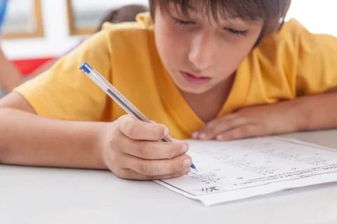 Boy writing Stock Photos
