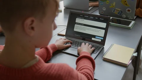 Boy Writing Prompt for Artificial Intelligence Image Generator at Lesson Stock Footage 318720913
