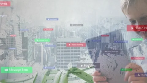 Boy writing on tablet by window viewing skyline, using technology with floating Stock Footage 328595544