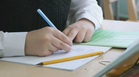 The boy writing the text in the copybook 動画素材 69001405