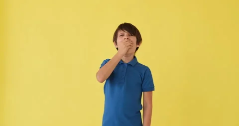 Boy yawning over yellow background Stock Footage 145235985