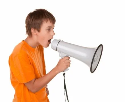 Boy yelling into a megaphone Foto stock