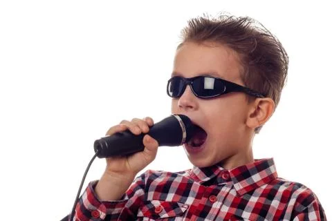 Boy yelling in microphone Stock Photos