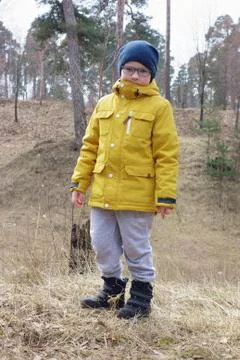 Boy in a yellow jacket Stock Photos