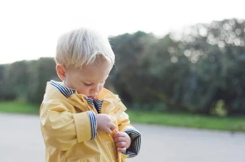 Boy zipping up coat Stock Photos