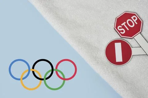 Boycotting Olympic Games - Restricting traffic sings and Olympic flag on towel Stock Photos