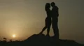 Boyfriend and girlfriend kissing, looking at sunset. Happy together forever HD Footage