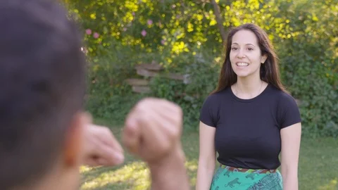 Boyfriend does funny lasso dance move on girlfriend.  - Slow Motion - shot on Stock Footage 125166154