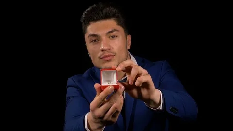 Boyfriend opening ring box and offering ring Stock Footage 74678174