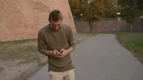 Boyfriend is writing an SMS message to his girlfriend. Stock Footage 88950876