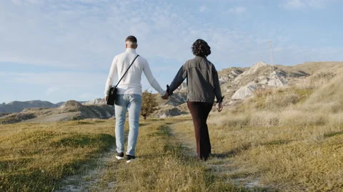 Boyfriends walking hand in hand Stock Footage 232035142