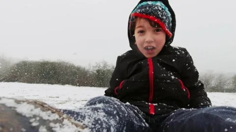 BoyOnSledgeLaughing 4k 30fps 動画素材 148124173