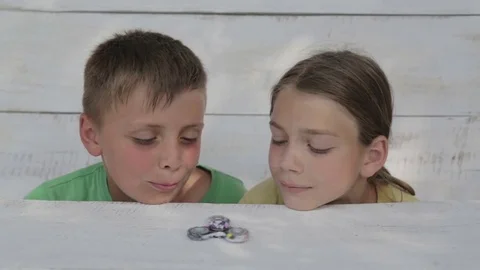 The boys are playing with the spinner. Stock Footage 77059677
