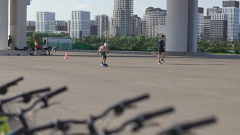 Boys in athletic uniforms ride roller skates across area Vídeo Stock 326461273